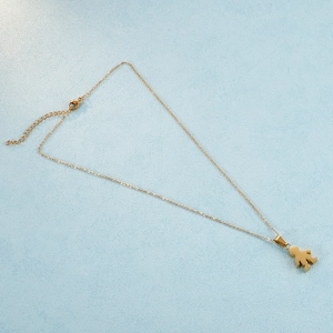Minimalist gold-plated stainless steel necklace featuring a small boy pendant with extension chain