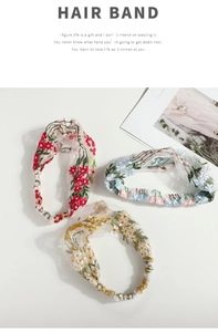Detailed view of three floral embroidered mesh hair bands with elegant cross-knot design