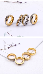 Detailed view of silver and gold stainless steel beaded rings with micro-pave zirconia