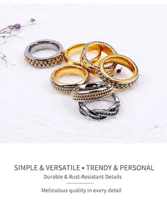 Detail shot of stainless steel bead chain rings and micro-pave zircon bands in gold and silver