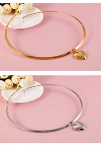 Choker necklaces with heart pendants in gold and silver finish on a floral display