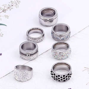 Set of seven silver stainless steel rings with crystal pave and Roman numerals