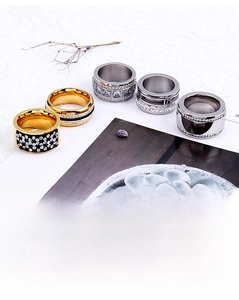 Flat lay of multiple crystal encrusted gold and silver fashion rings for women