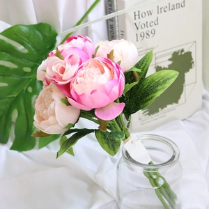 Pink artificial peony flower bouquet in glass vase for wedding and home decor
