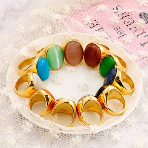 Titanium steel oval opal and turquoise rings set in gold finish on white lace
