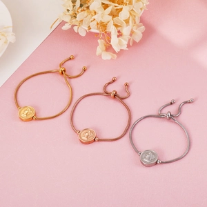 Three minimalist stainless steel coin pendant bracelets in gold, silver, and rose gold