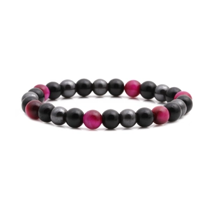 Macro detail of bead bracelet featuring tiger eye stones and matte black volcanic lava rock