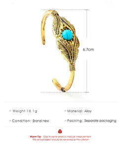 Detailed specs of the vintage feather cuff bracelet with turquoise inlay and alloy material