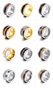 Collection of titanium steel rings featuring shell inlays, resin patterns and crystal stones