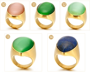 Detailed grid view showing gold titanium steel rings with various cat eye and stone inlays