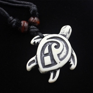 Adjustable wooden bead necklace with a carved turtle pendant on black cord