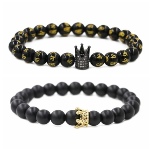 Beaded crown bracelets for couples featuring matte and glossy black stones in gold finish