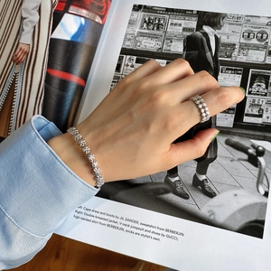 Close-up of S925 sterling silver ring and bracelet set with retro cross star embossing