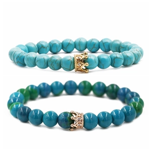 Turquoise and crown beaded couple bracelets featuring natural stone and gold accents