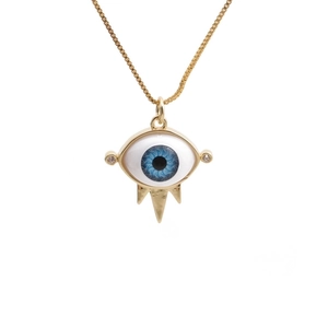Golden Evil Eye necklace with a blue centerpiece and crystal accents on white background