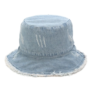 Detail of light blue denim bucket hat featuring stylish frayed edges and vintage distressing