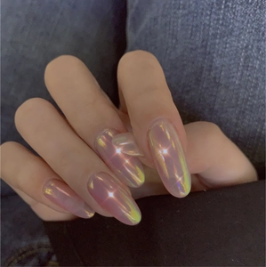 Detail of long oval aurora pink press-on nails with golden and green iridescent shimmer