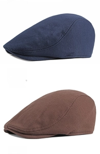 Detailed comparison of navy blue and coffee brown knitted newsboy caps in soft fabric
