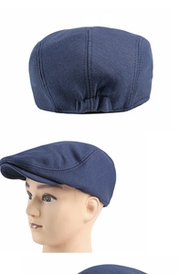 Detail view of navy blue cotton beret hat featuring elastic back and precise stitching