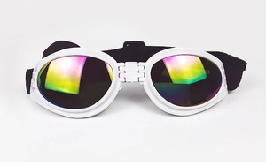 Close-up of foldable white pet goggles with rainbow lenses and adjustable black elastic strap