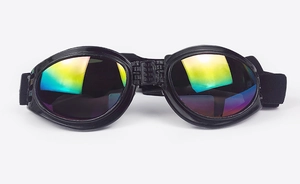 Close-up of foldable pet sunglasses with rainbow reflective lenses and black frames