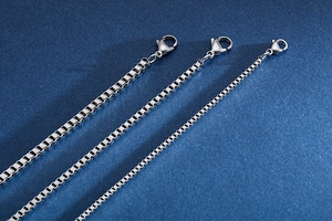 Detailed comparison of three silver box chains in various thicknesses with lobster clasps