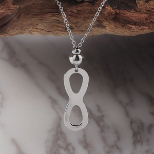 Set collana con simbolo infinito in acciaio inossidabile argento da donna su legno