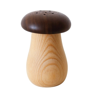Cute mushroom-shaped black walnut toothpick holder with natural wood grain on white background