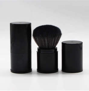 Retractable black makeup brush with soft bristles for powder and blush application