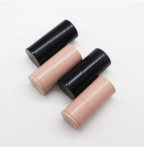 Detail view of retractable makeup brush covers in black and beige smooth finish