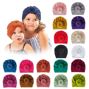 Selection of 18 colors knitted donut baby turban hats for infants and toddlers