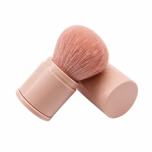 Portable retractable makeup brush for powder and blush with a pink matte finish