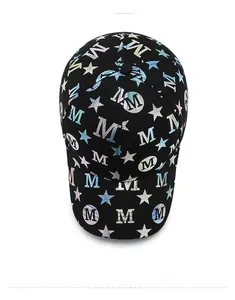 Top view of a black cotton baseball cap with laser metallic letter M and star pattern