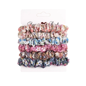 Detail of 6-piece floral scrunchie set with various patterns on a white display card