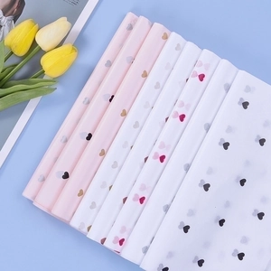 Pastel tissue paper with heart patterns for floral bouquets and gift wrapping