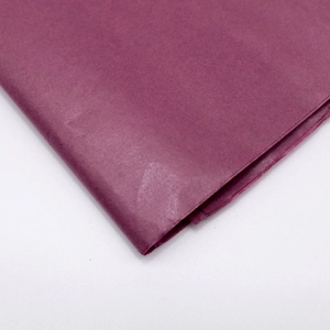 Close-up of folded fuchsia tissue paper showing soft texture and fine details