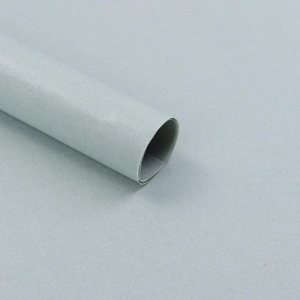 Close-up of grey tissue wrapping paper roll for floral bouquets and gift packaging
