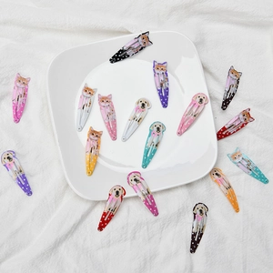 Cute pet print BB hair clips for girls featuring colorful cat and dog patterns on white tray