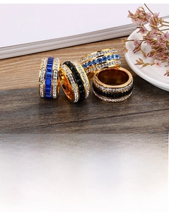 Detailed view of 18k gold plated stainless steel rings with colorful zircon stones