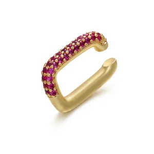 Gold plated brass ear cuff featuring purple-red cubic zirconia in a rectangular U-shape