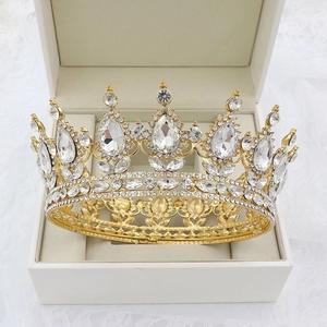 Close-up of golden Baroque bridal crown with pear-shaped rhinestones in a gift box