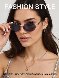 Close-up of elegant rimless oval sunglasses with grey-purple gradient lenses and gold frame