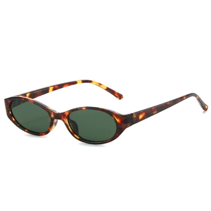 Retro oval tortoiseshell sunglasses with dark green lenses and thick full-frame design