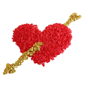 Romantic red rose petal heart pierced by a golden foil arrow for wedding decor