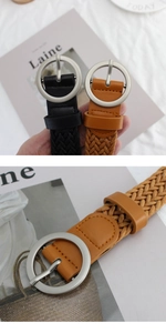 Detail of woven wax cord belts in black and tan colors with silver round metal buckles