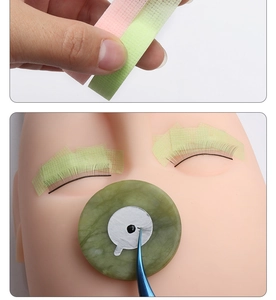 Detail showing breathable non-woven lash tape application with pink and green mesh tape options
