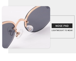Detail view of transparent nose pads on rose gold metal frame for lightweight comfort