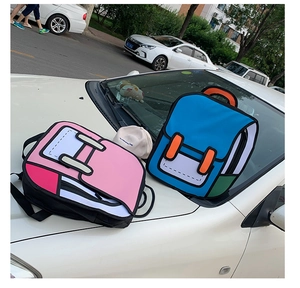 Outdoor shot of 2D cartoon style pink and blue backpacks on a white car hood