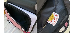 Detail of pink 2D cartoon style backpack showing the main compartment and inner zip pocket
