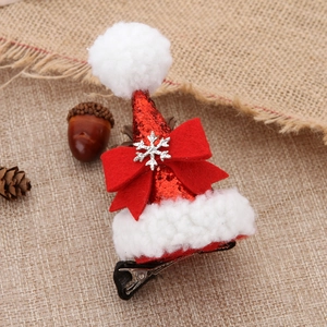 Sparkly sequins Christmas hat hair clip with red bow and silver snowflake on burlap background